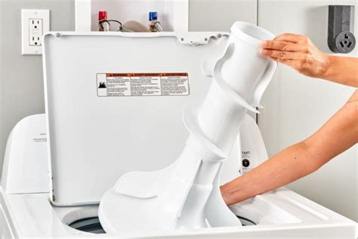 How does a washing machine without agitator work?